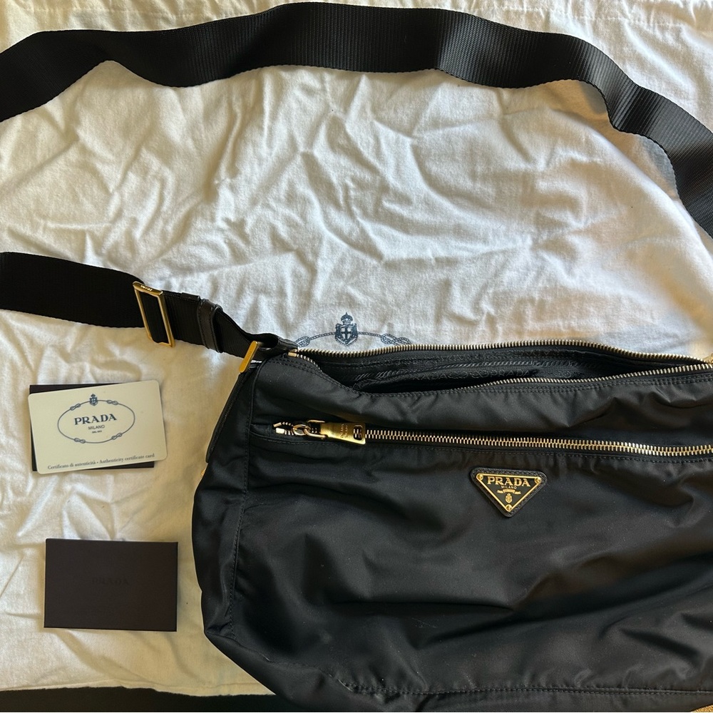 Prada Vela Nylon Sling Bag. Black with gold hardware.